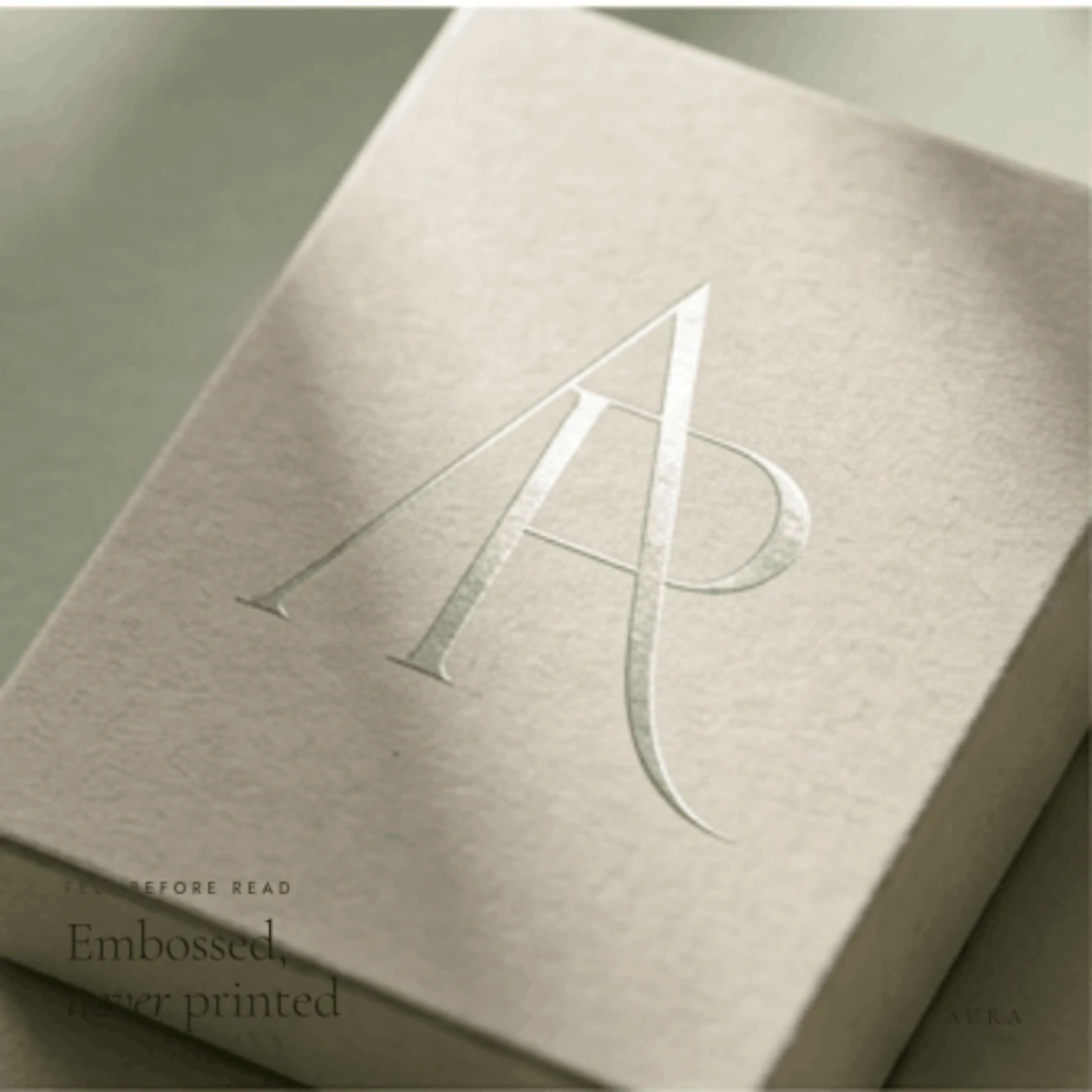 AURA embossed monogram on packaging